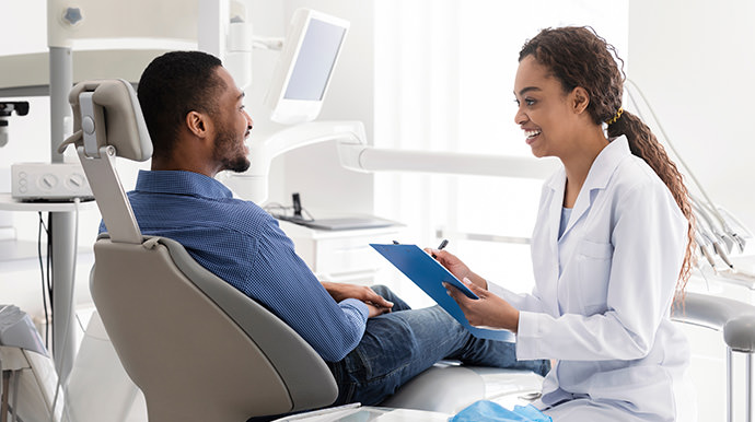 Dentist asking patient questions