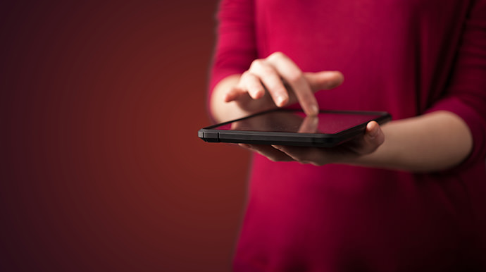 Woman holding computer tablet