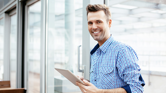 Man holding computer tablet