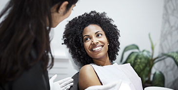 Smiling patient in dental chair