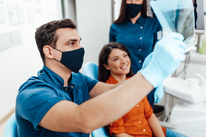Woman talking with dentist