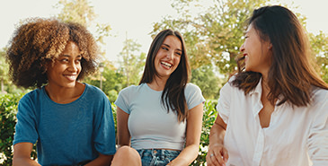 Three friends talking and laughing
